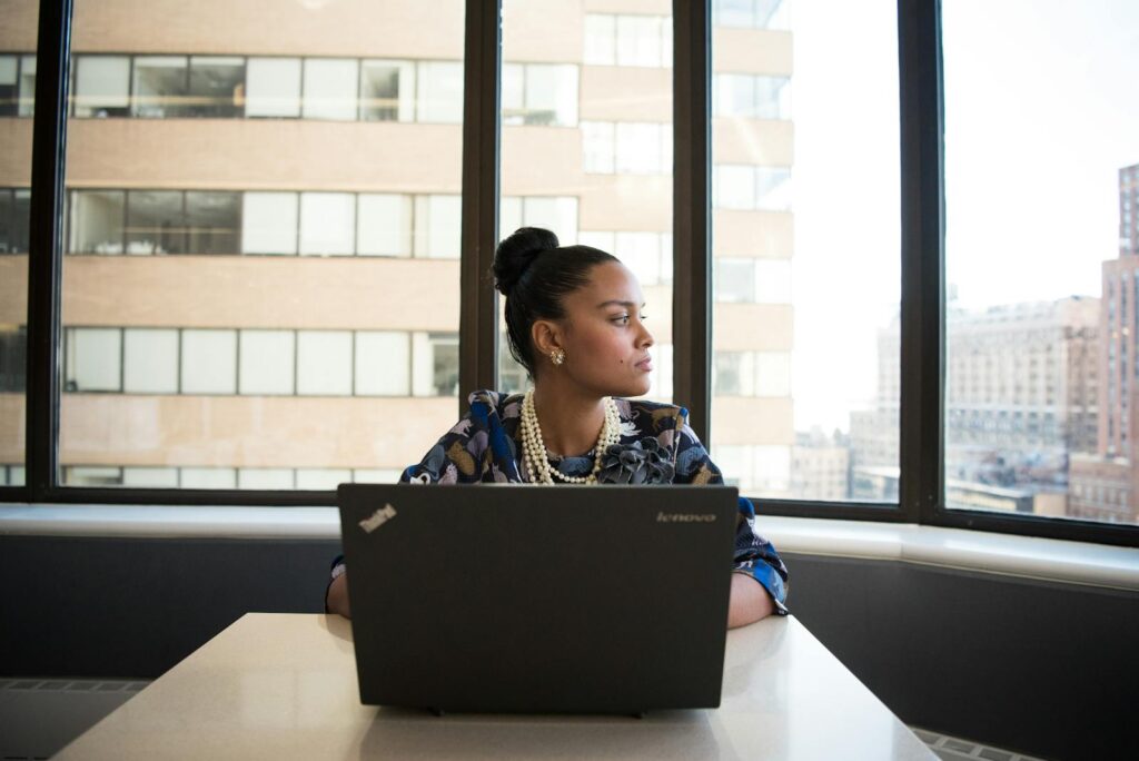 Convert your email list Woman Sits in Front of Black Laptop Computer