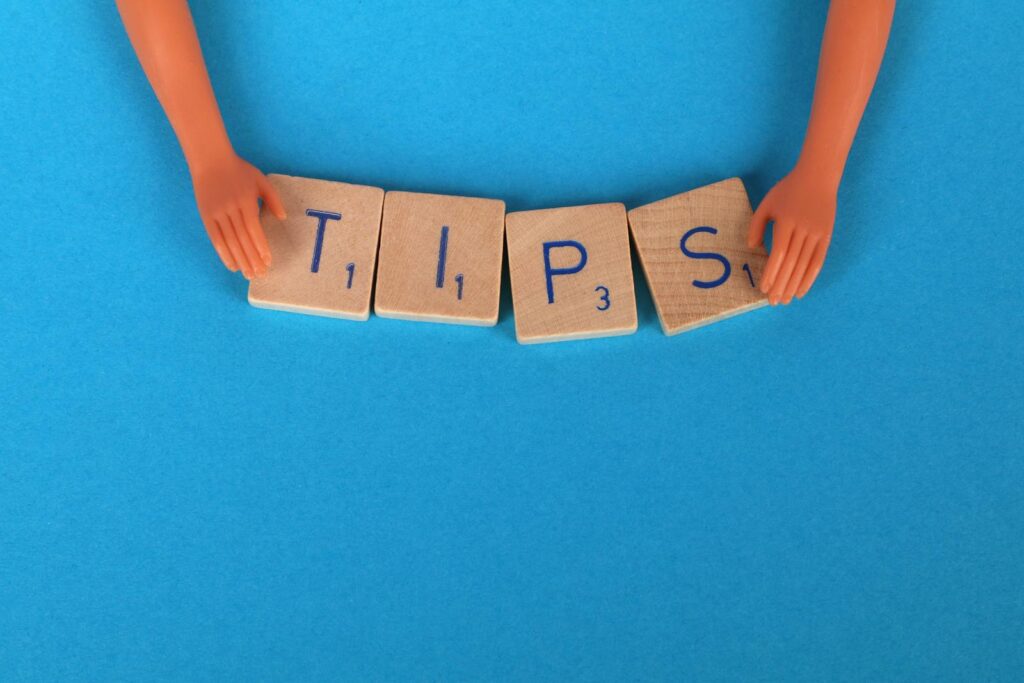 Email Marketing Tips Close-Up Shot of Scrabble Tiles on a Blue Surface