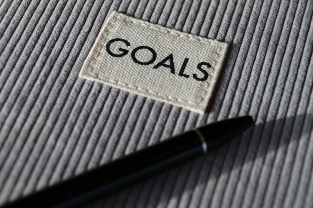 Effective Goal Setting black and silver pen on gray textile